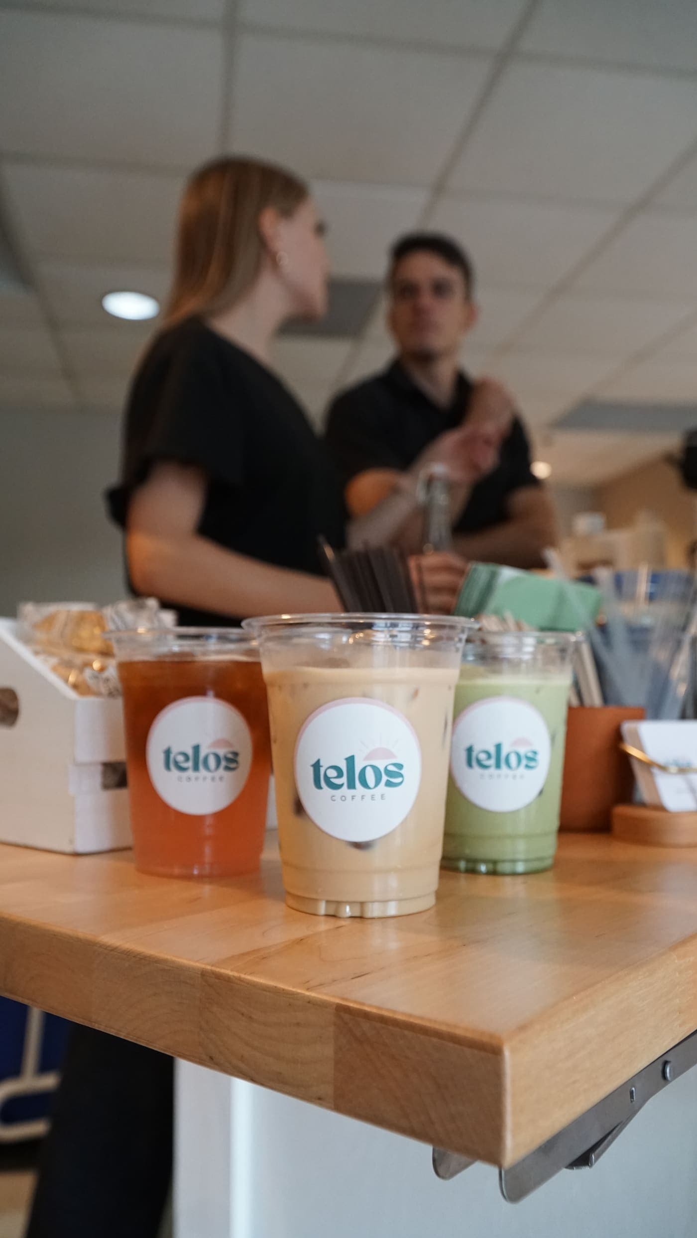Three finished drinks lined up on the counter